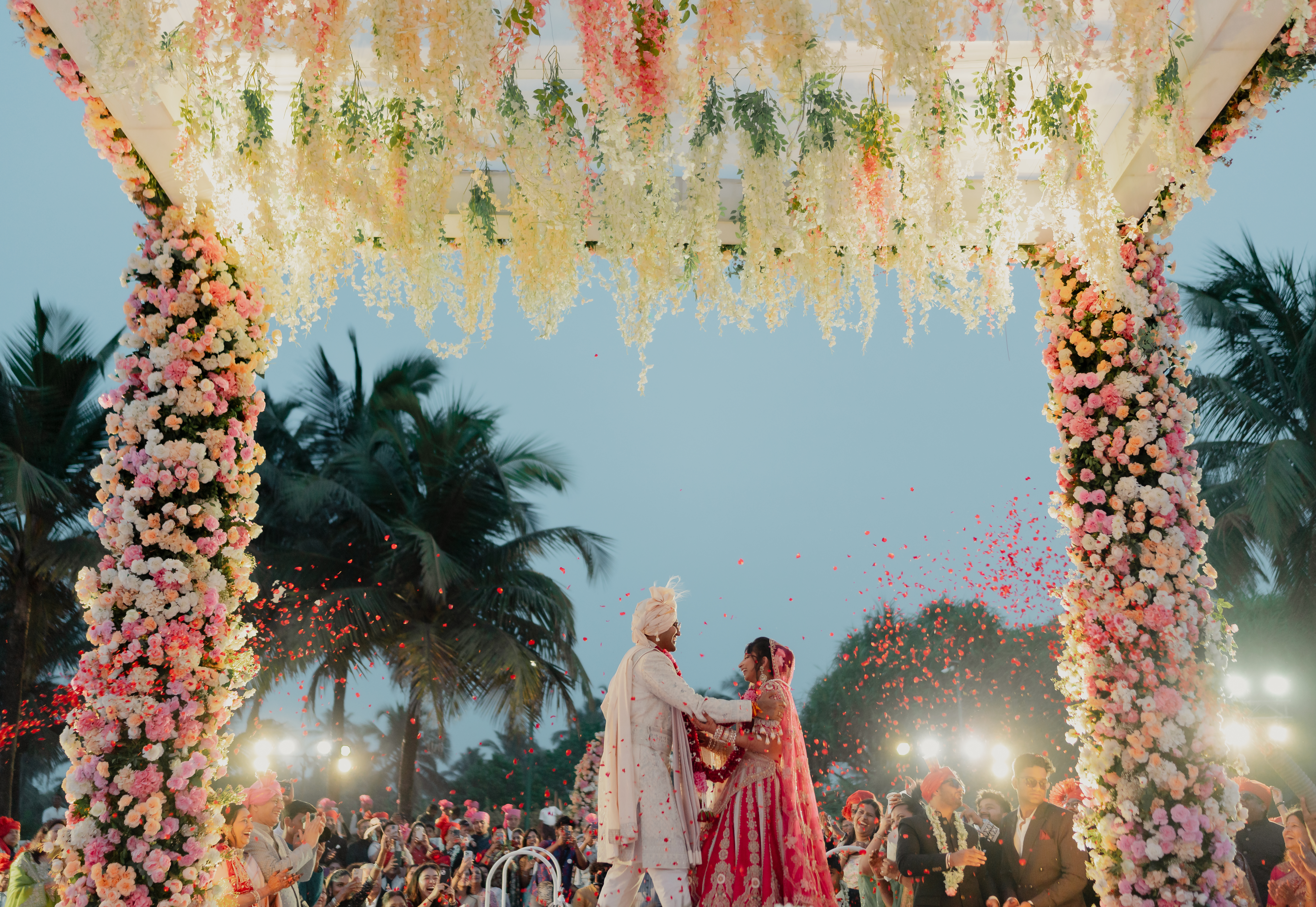 Haldi ceremony decor with yellow marigold flower circle backdrop and traditional seating arrangement