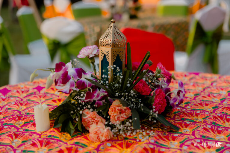 Rustic haldi decor centerpiece with turmeric bowls, flowers, and handcrafted Indian elements